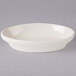 A white Tuxton oval bowl with a small rim.