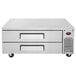 A stainless steel Turbo Air refrigerated chef base with two drawers and black wheels.