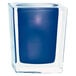A Sterno square glass candle holder with a blue candle inside.