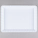 A white rectangular tray with scalloped edges.