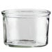 A clear glass container with a lid.