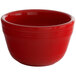 A red Tuxton China bouillon cup.