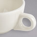 A Homer Laughlin ivory china cup with a handle.