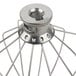 A KitchenAid wire whip attachment with a wire cage and metal nut.