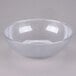 A clear pebbled bowl with a white rim.