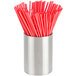 A stainless steel round sugar packet holder filled with red and white straws.
