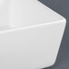 A close-up of a CAC square white china bowl.