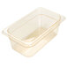 A Carlisle amber plastic food pan with a clear lid.