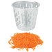 A silver King Kutter container with a pile of shredded carrots inside.