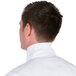 The back of a man wearing a white Intedge chef neckerchief.