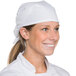 A woman wearing a white Intedge chef neckerchief and hat.