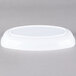 A white plastic dish on a gray background.