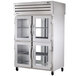 A True stainless steel pass-through refrigerator with glass doors.
