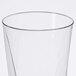 A close-up of a Fineline clear square bottom tumbler with a thin rim.
