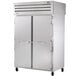 A True stainless steel pass-through refrigerator with two solid doors.