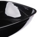 A close-up of a Fineline black plastic Luau bowl.