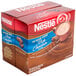 A red box of Nestle No Sugar Added Hot Cocoa mix packets with white text.