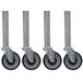 A row of Advance Tabco galvanized casters with black rubber wheels.