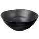 A 10 Strawberry Street matte black stoneware serving bowl with a wavy design.