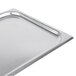 A Vollrath stainless steel 1/2 size steam table pan with lid.