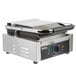 A Galaxy stainless steel Panini sandwich grill machine with smooth plates on a counter.