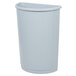A gray Rubbermaid half round trash can with a lid.