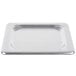A silver stainless steel Vollrath Super Pan 3 cover on a white counter.