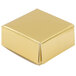 A 2 1/2" x 2 1/2" gold foil candy box with lid.