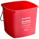A red Noble Products sanitizing pail with a handle.