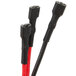 A close-up of a black cable with black and red connectors.