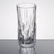 A Nachtmann Shu Fa longdrink glass with a pattern on it sitting on a table.