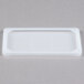 A white rectangular Flexsil lid on a white rectangular pan.