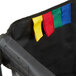 A black Rubbermaid laundry bag with colorful ribbons tied to it.