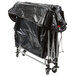 A black tarp on a metal cart with wheels and a handle.
