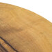 An American Metalcraft round melamine serving board with a faux olive wood surface.