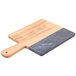 An American Metalcraft olive wood and black marble serving board with a wooden handle.