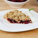 A slice of Lucky Leaf cherry pie with a cherry on top.