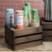 An American Metalcraft wooden crate holding a stack of coffee cups.