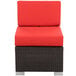 A BFM Seating Aruba wicker armless chair with a red cushion.