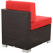 A BFM Seating Aruba Java wicker armless chair with a red cushion.