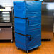 A blue vinyl Cres Cor bun pan rack cover over a metal oven.
