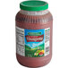 A plastic container of red Hidden Valley Raspberry Vinaigrette.