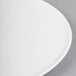 A close-up of a Libbey Aluma White porcelain round tray.