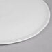 A Libbey Aluma White porcelain round tray with a small rim.