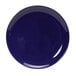 A white china plate with a blue circle.
