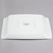 A white square Libbey porcelain platter with handles.