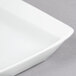 A Libbey Aluma White porcelain platter with a small handle.