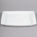 A white rectangular Libbey Aluma White porcelain platter with square edges on a gray background.