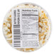 A container of Grandma Jack's Gourmet Buttered Popcorn with a label.