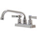 A chrome Advance Tabco deck-mount faucet with two handles and a 6" swing nozzle.